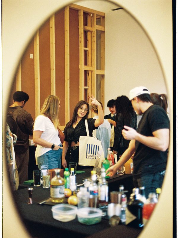 Event scene reflected in an oval mirror